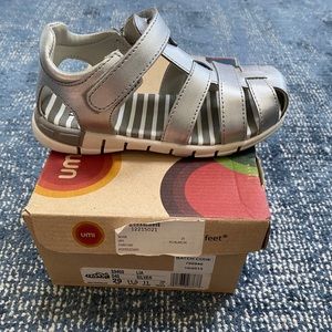 New in box. Silver sandal.